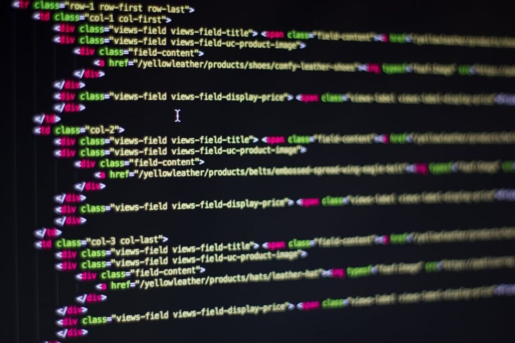 Detailed close-up of HTML code on a computer monitor, showcasing web development.